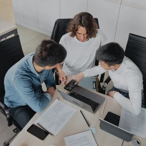 FiNASAL technology specialists working together on software development and banking IT support