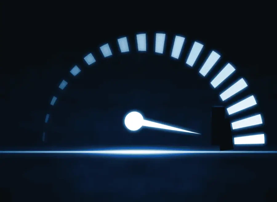 Speedometer gauge graphic illustrating performance engineering, software load testing, and system response optimization